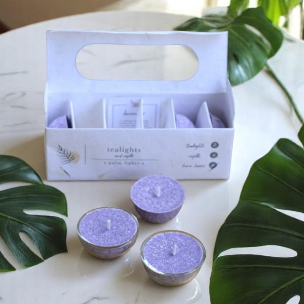 A box of hand-poured Lavender Forever tealights made with palm wax and natural essential oils.