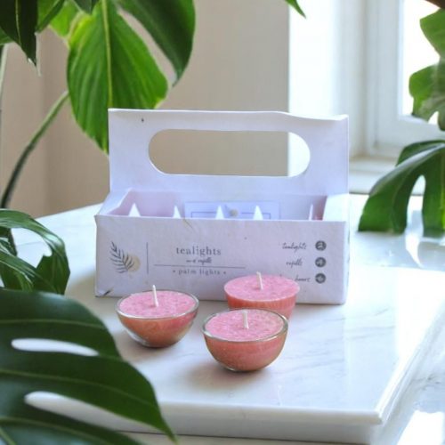 A box of hand-poured Aura of Palmarosa tealights made with palm wax and natural essential oils.