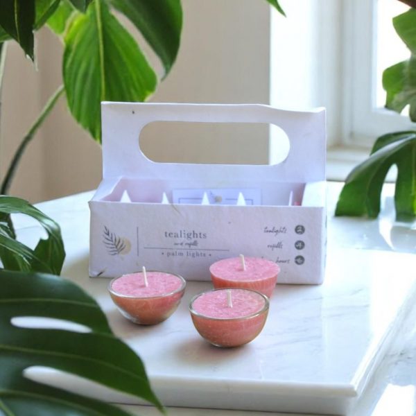 A box of hand-poured Aura of Palmarosa tealights made with palm wax and natural essential oils.