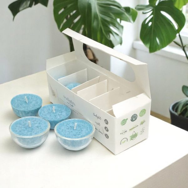 A box of hand-poured Bit of Aftershock tealights made with palm wax and natural essential oils.