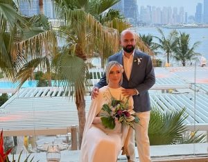 Couple at Dubai beachfront wedding venue with custom wedding candles by Palm Lights