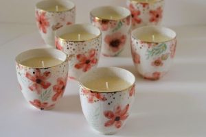 Handmade stoneware candles with floral design by Palm Lights Dubai