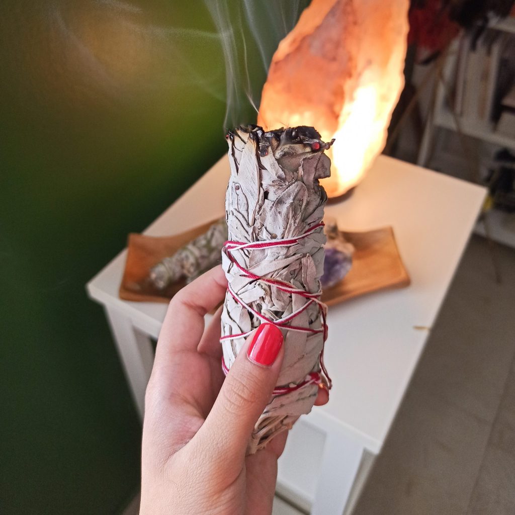 White sage smudging ritual for cleansing energy and purifying space