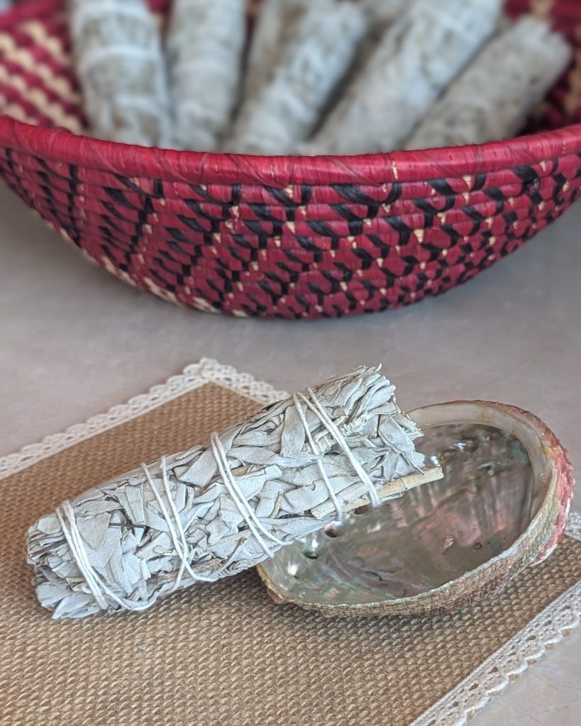 White sage smudge stick with abalone shell for energy cleansing ritual