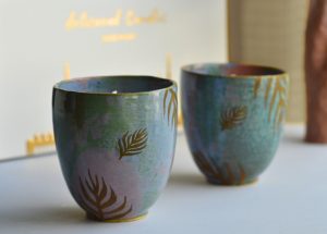 PalmLights sustainable stoneware candles with leaf design placed in a modern home setting for eco-friendly decor