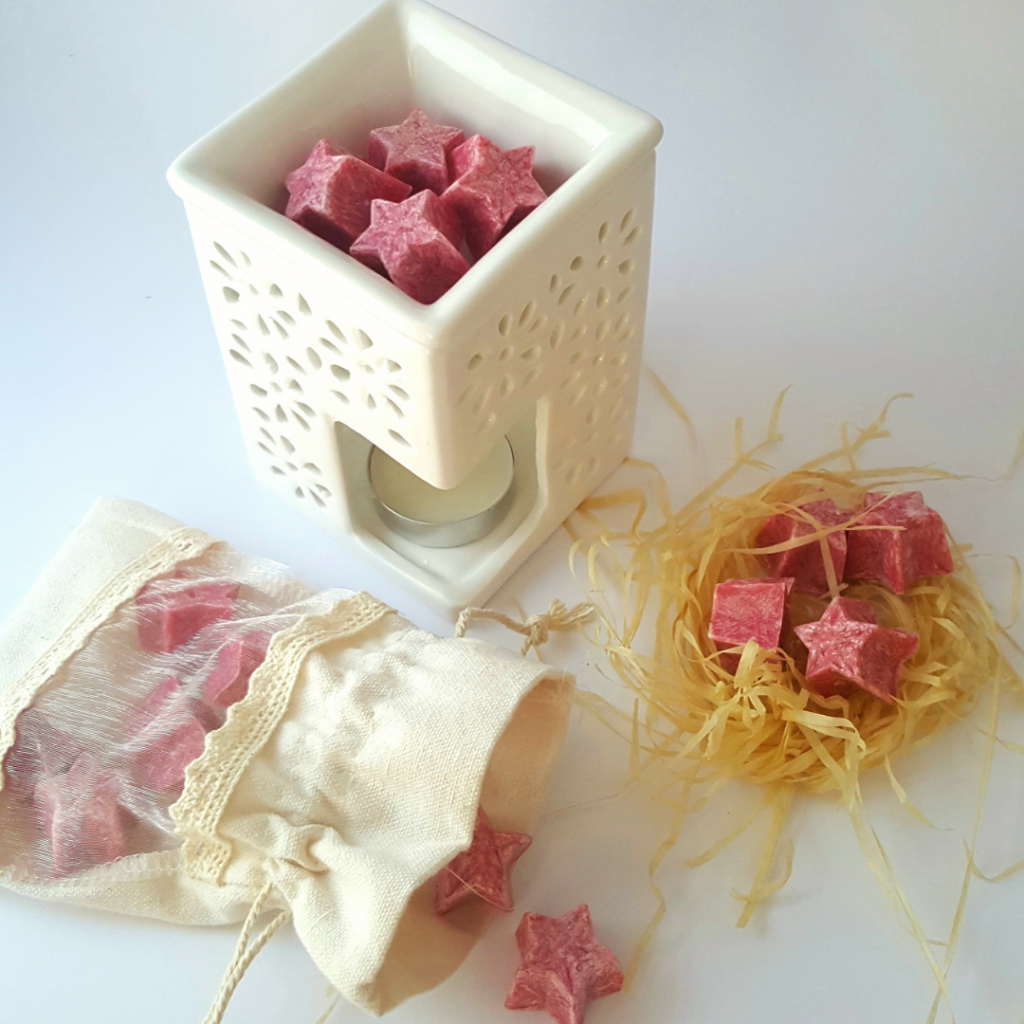 Palm Lights blue and pink star shaped wax melts in hand