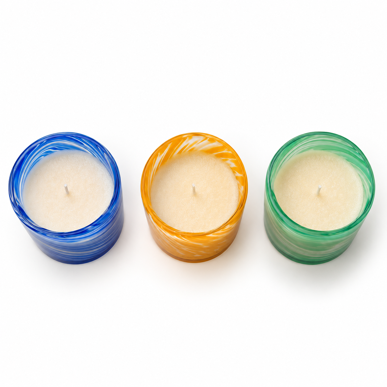 Overhead view of three Palm Lights Ayurveda candle lids arranged together, white background